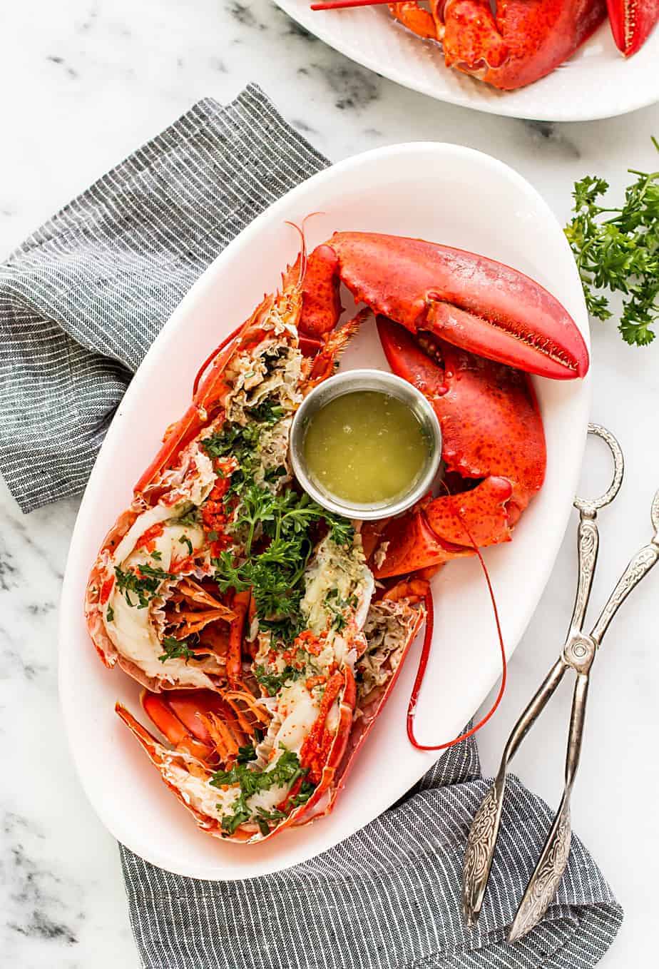 Easy boiled Lobster with homemade Lemon Butter Dip Sauce recipe. boiled lobster with garlic lemon butter dip sauce. Learn how to boil lobster in salted water and a trick on how to cook live lobster humanely.