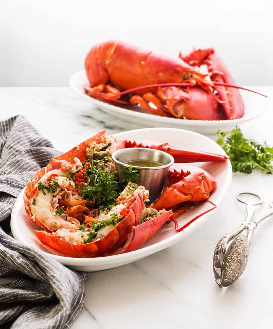 boiled lobster with garlic lemon butter dip sauce. Learn how to boil lobster in salted water and a trick on how to cook live lobster humanely.