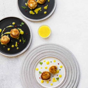 Looking for seafood appetizer recipes? Try these pan seared scallops, served with a tangy mango vinaigrette recipe. It’s a great food and wine pairing recipe for your next party or special night.