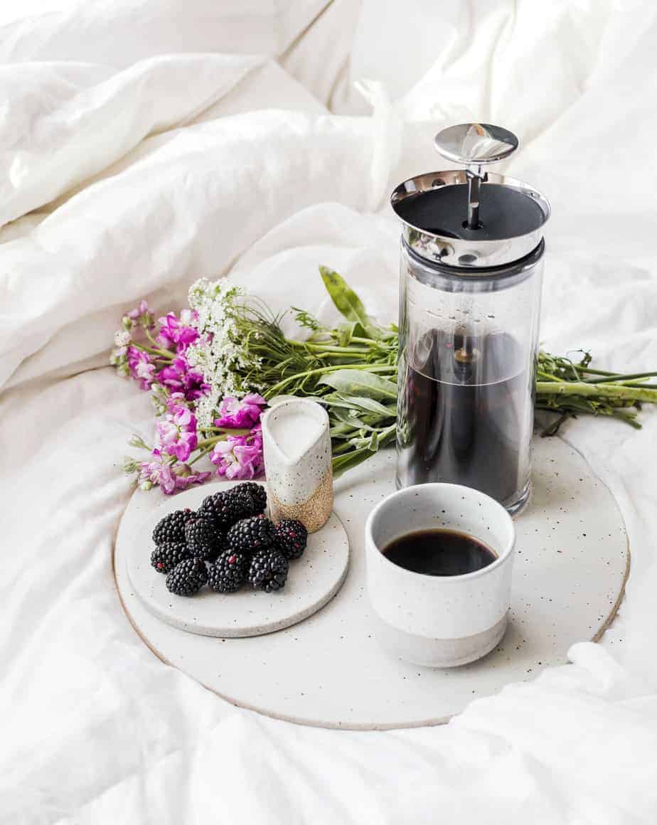 Learn how to make an iced coffee mocha recipe at home. Brewed coffee served with homemade chocolate syrup, ice, and whipped cream.