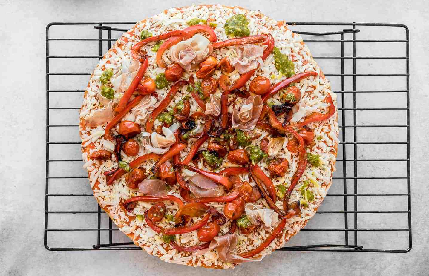 gluten free pizza with prosciutto and pesto