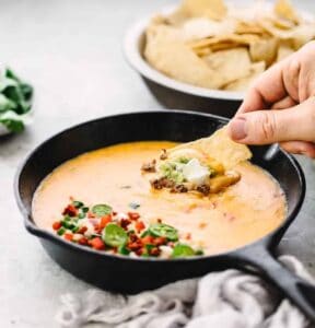 Instant Pot Queso Dip Recipe with Ground Beef, served with Mission Tortilla Strips