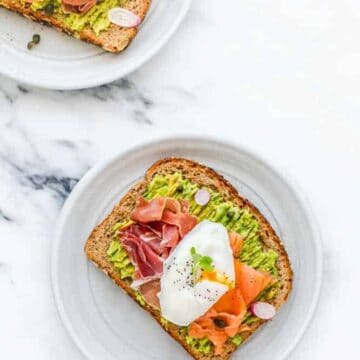 Smashed Avocado on Toast with Egg, Smoked Salmon, and Prosciutto