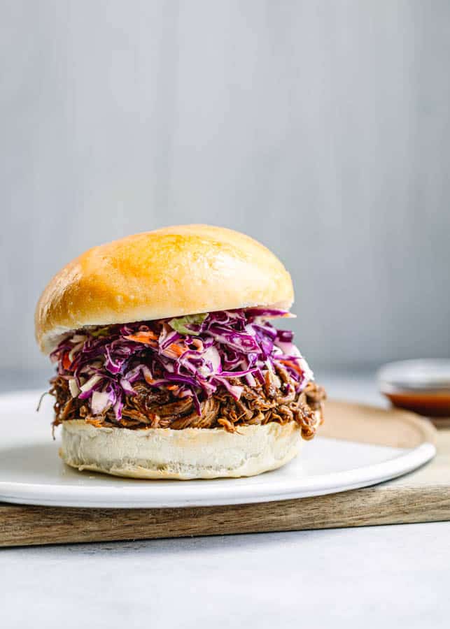 Instant Pot Brisket Recipe on a bun and coleslaw