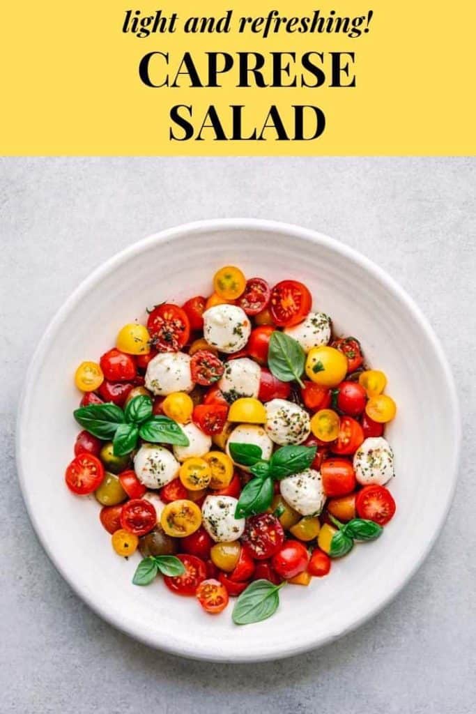 caprese salad with tomato,  mozzarella, basil, and vinaigrette