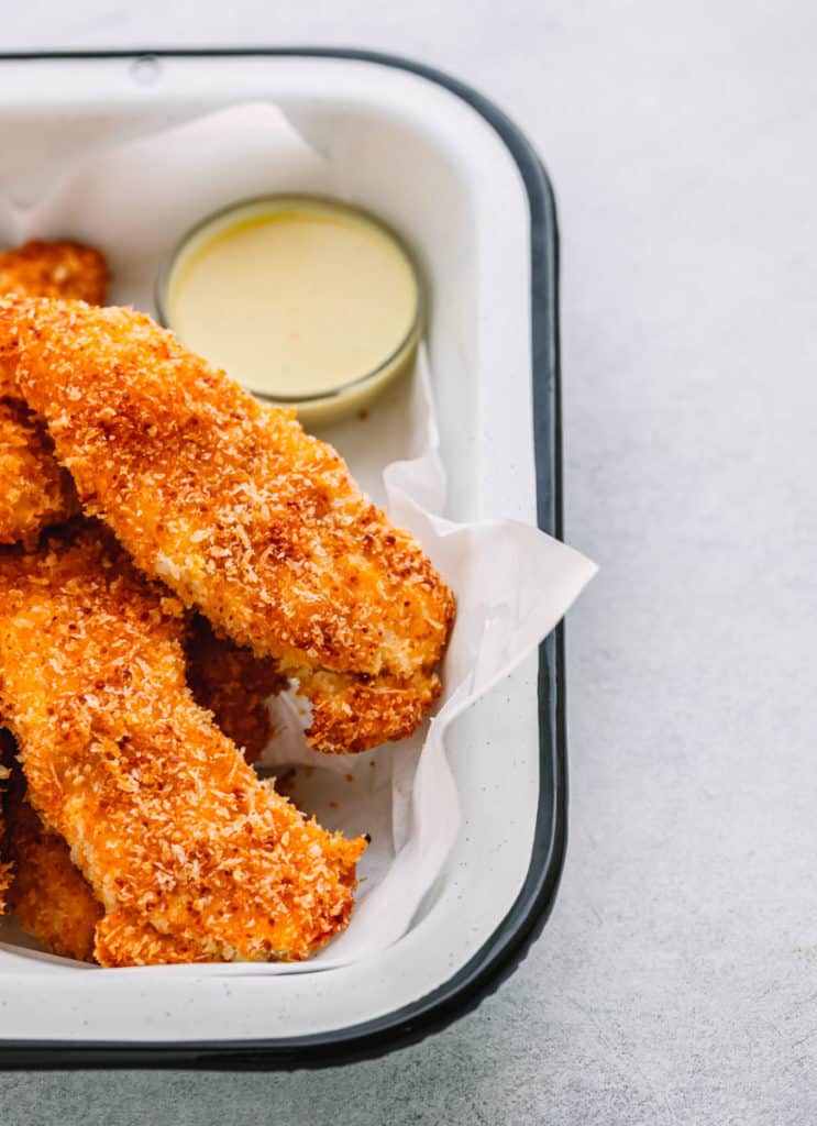 Healthy Baked Chicken Tenders or chicken fingers with Parmesan and Panko