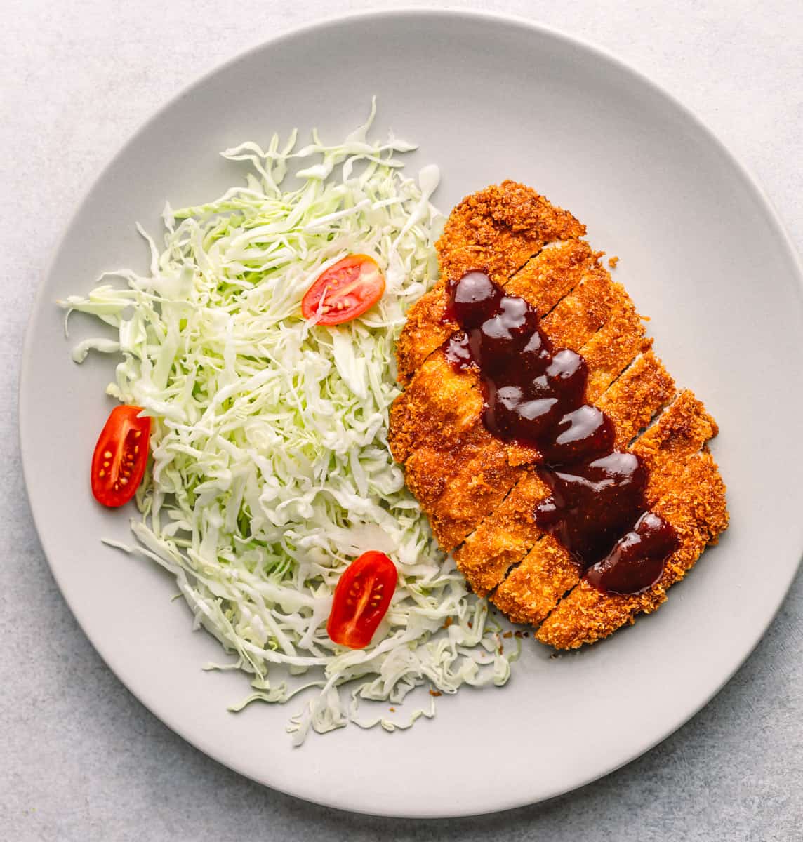 Tonkatsu with sauce and cabbage.