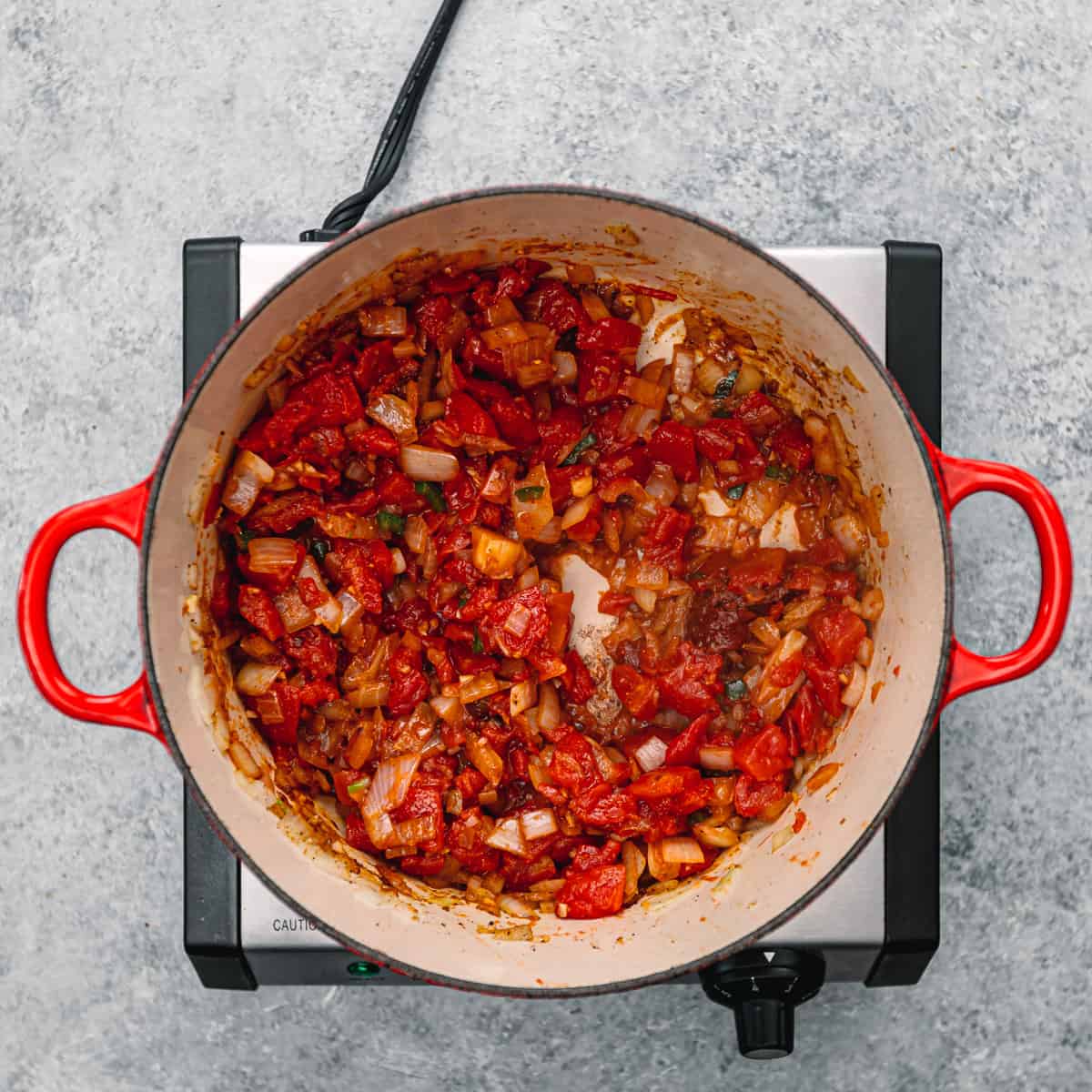 diced tomatoes in a pot.