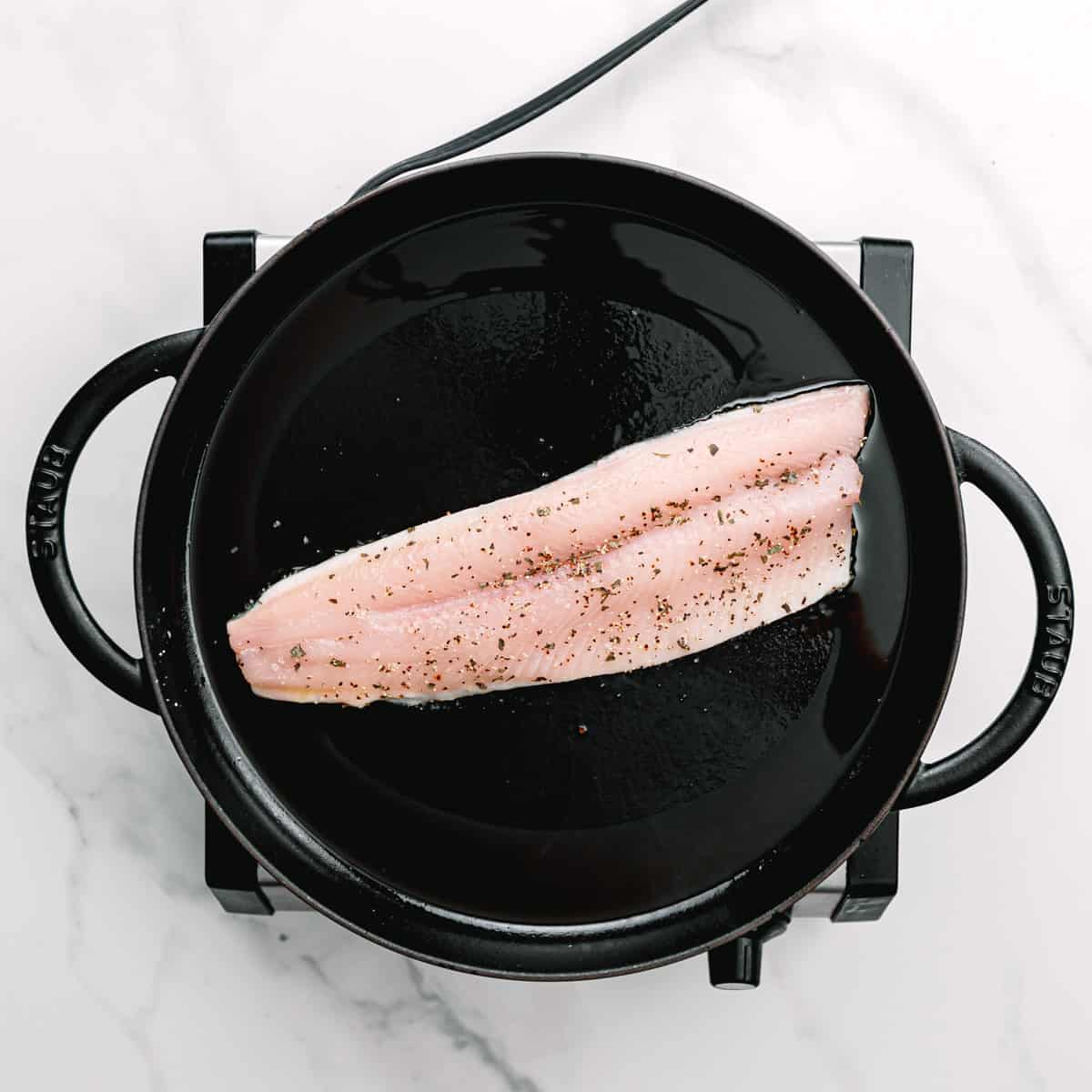 cook the fish fillets, skin side down.