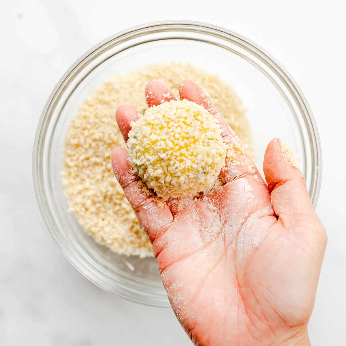 Coat the potato balls with panko breadcrumbs then (you guessed it), gently shake off excess. 