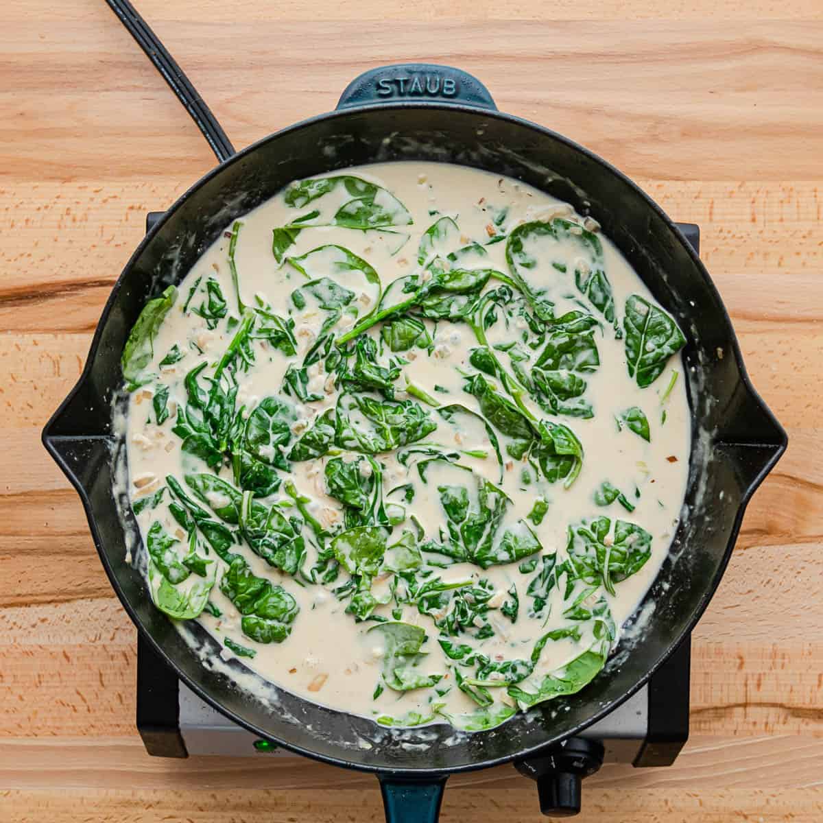 Stir in the spinach and continue cooking until it's wilted. 