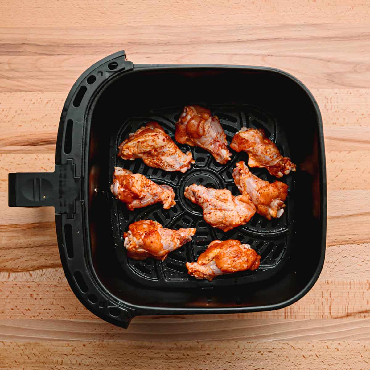 Add drummettes to the air fryer basket. Cook for about 10 minutes then flip, and continue cooking for 10 minutes. Transfer the drummettes to a large bowl. 