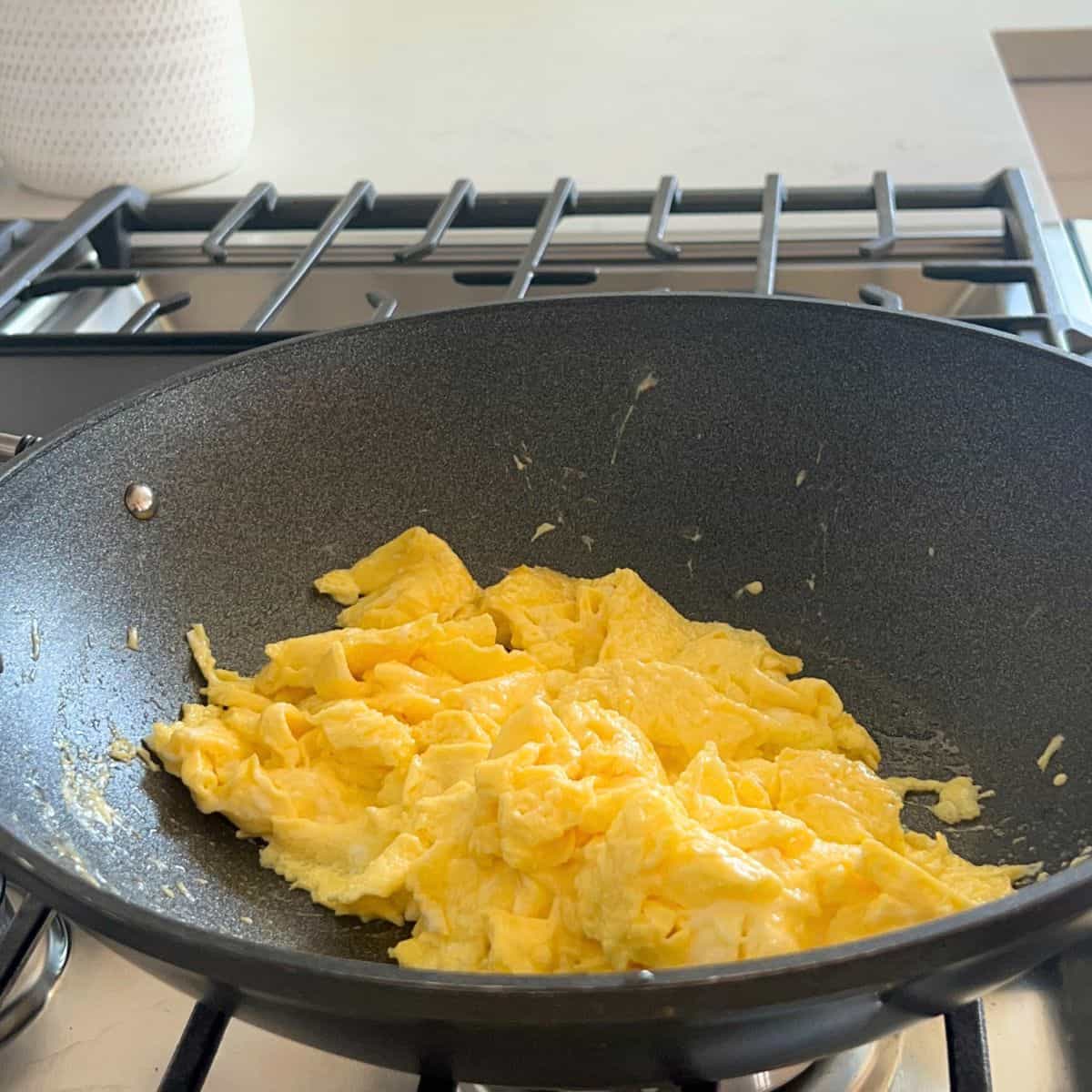 Add 2 tablespoons of oil then cook the eggs until they are just set but still runny. Stirring well and breaking them apart into large pieces for about 45 seconds. 