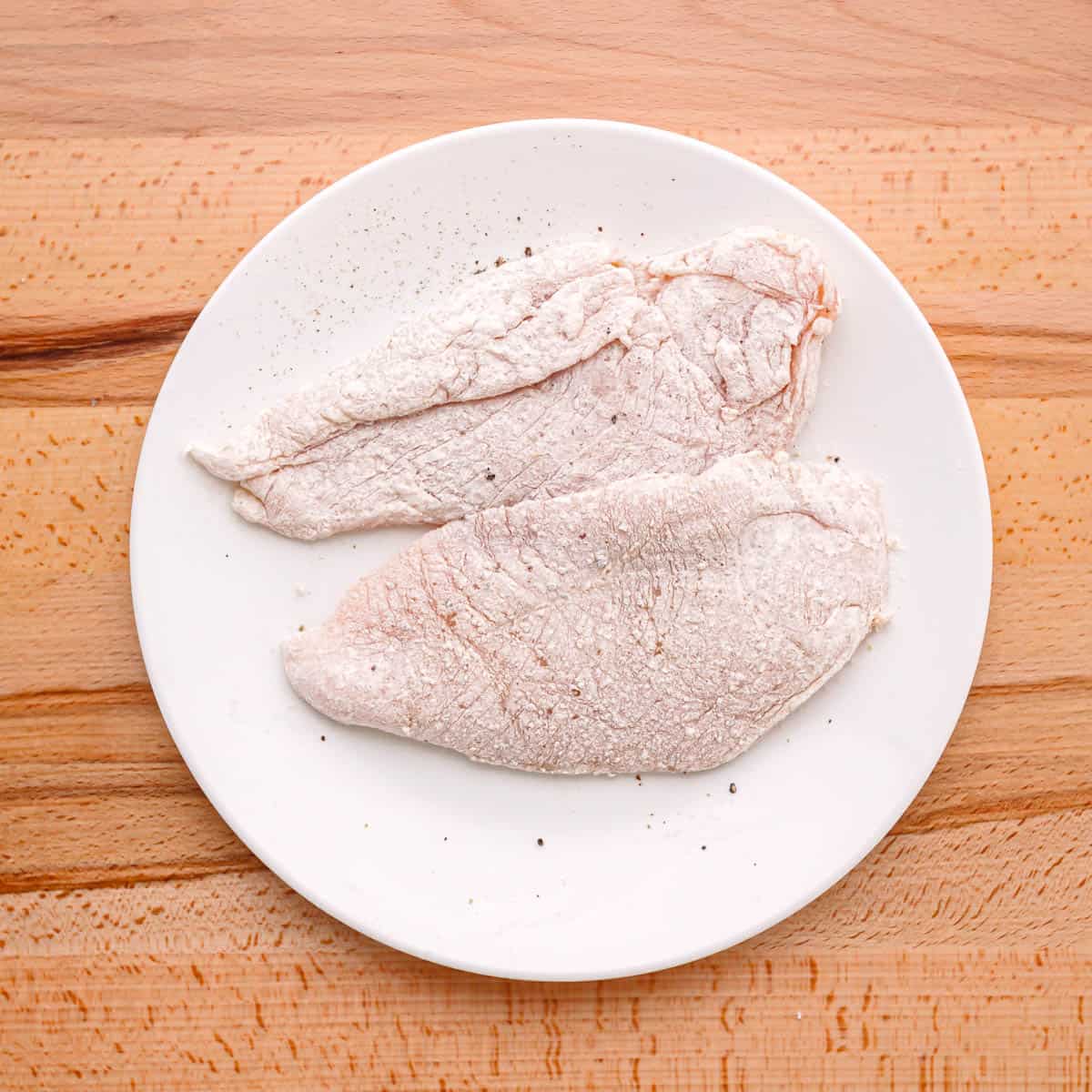 dredge the chicken breast in flour.