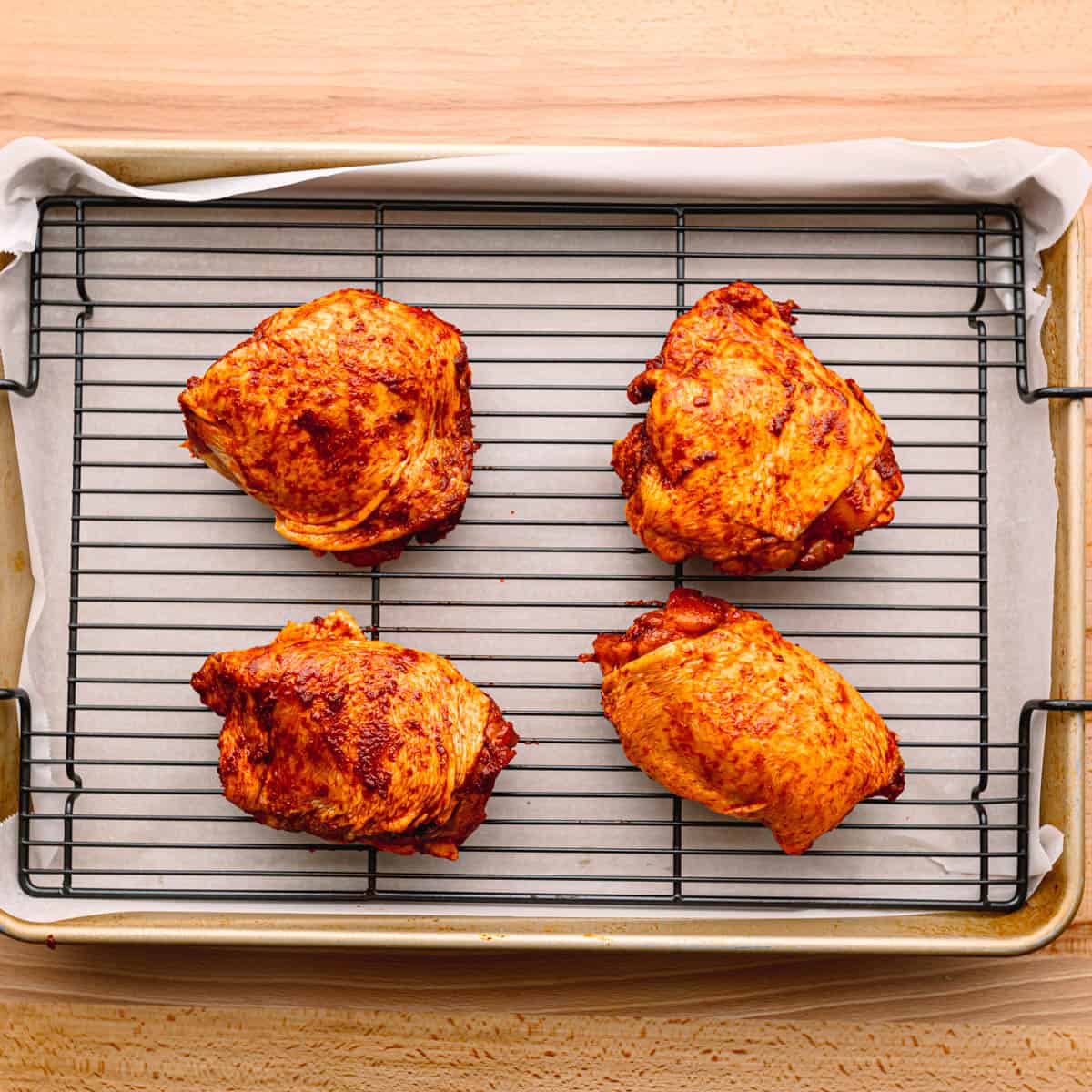 Line a baking sheet with parchment paper or foil for easy cleanup. For even browning, place a wire rack on top of the baking sheet to elevate the chicken and allow air to circulate around it.