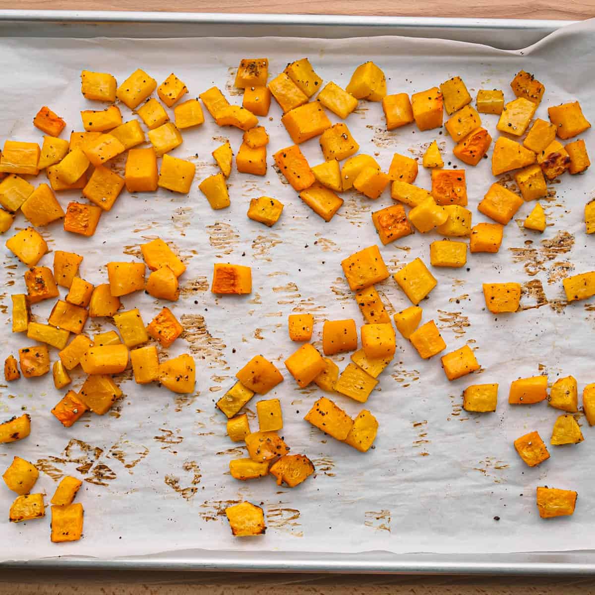  Now, transfer the mixture to a spacious baking sheet. Roast it in the oven for about 25-30 minutes.