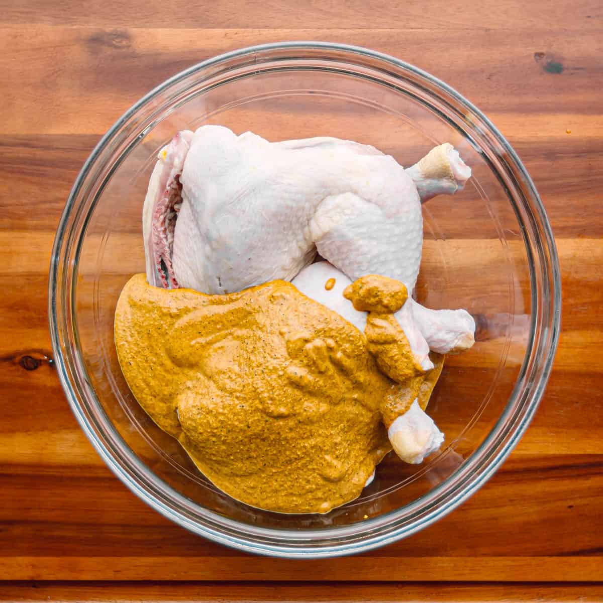 Place the chicken legs in a large bowl or zip-lock bag and add the marinade.