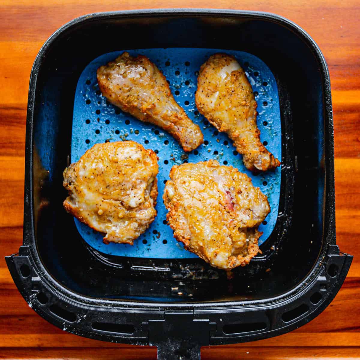 Now, let the air fryer work its magic for about 25 minutes or until the chicken is fully cooked.