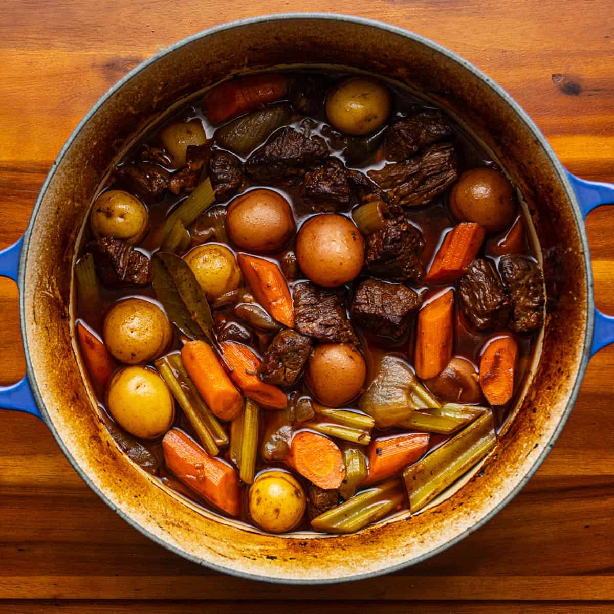 beef stew with carrot, potatoes, and celery.