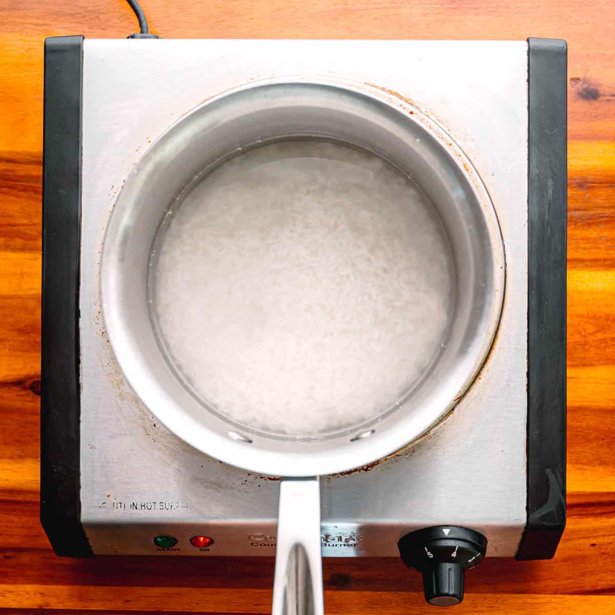rice and water in a saucepan.