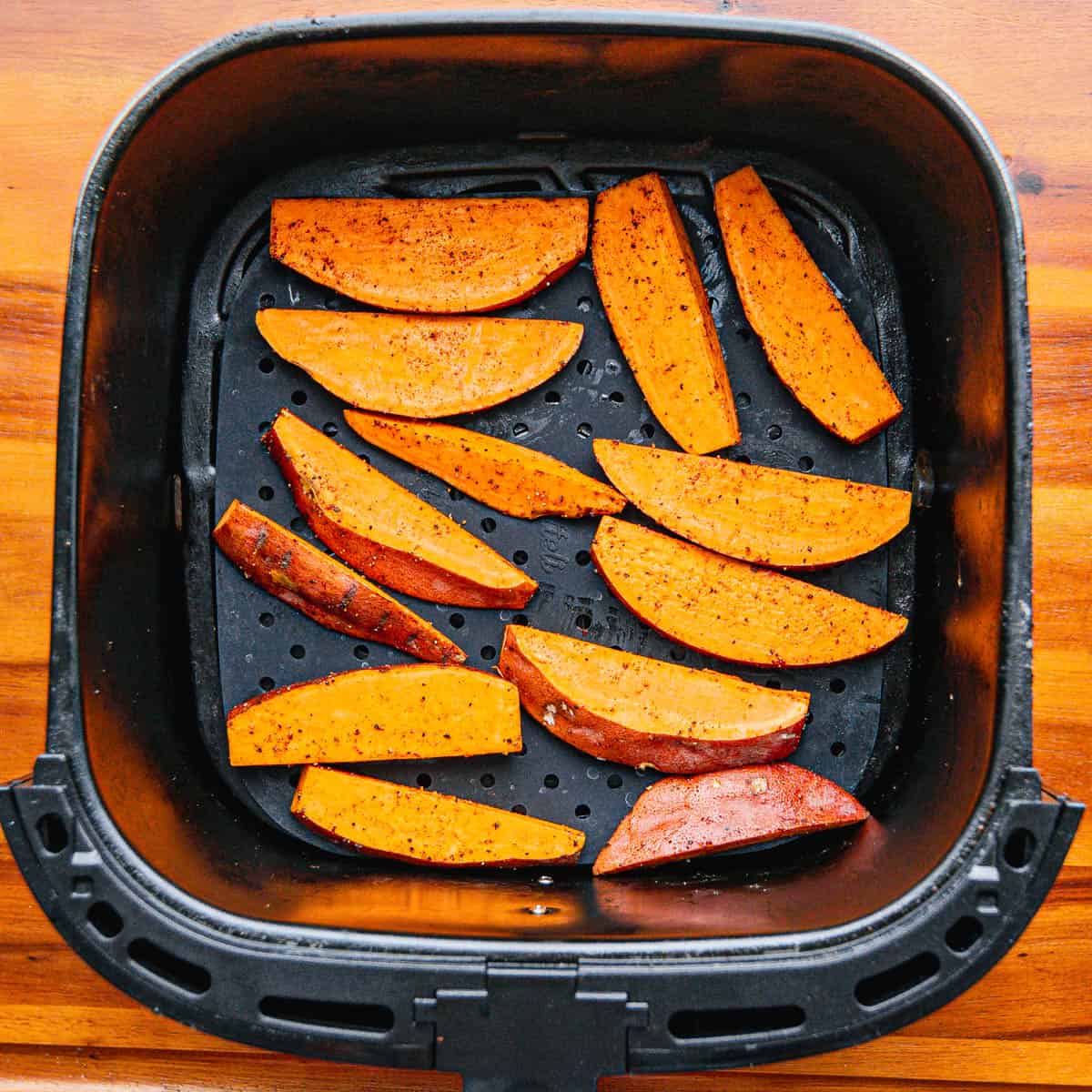Place the potato wedges in the air fryer basket in a single layer.