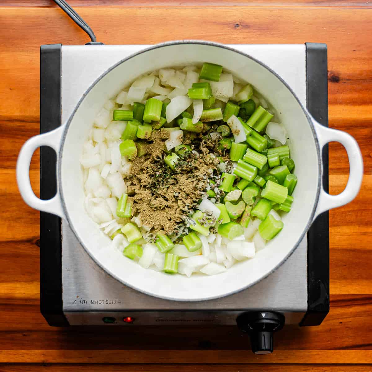 In a deep pan, melt butter and sauté celery, onion, sage, thyme, and poultry seasoning for 5-6 minutes until tender over medium heat.