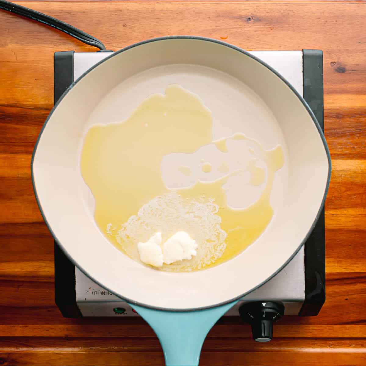 In a sauté pan, heat up some oil and melt the butter over medium-high heat.