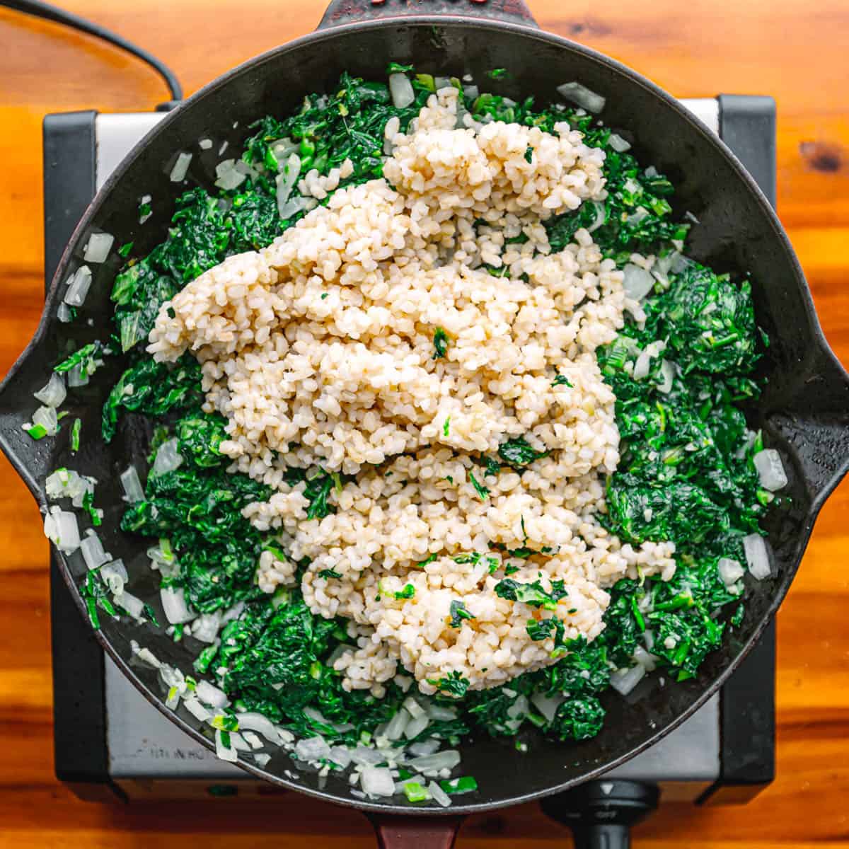 Add garlic and stir until fragrant. Incorporate spinach and stir for 2 minutes. 