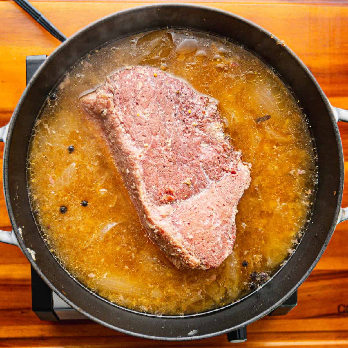 Bring the mixture to a boil over high heat, then reduce the heat to low. Cover the pot and let it cook for approximately 90 minutes per pound of meat.