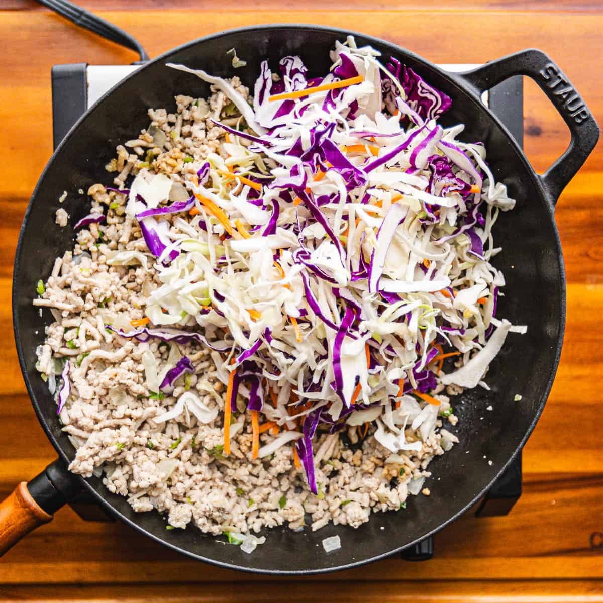 Add carrots and coleslaw mix. Add rice vinegar, sesame oil and the remaining soy sauce and stir until the vegetables are tender and meat is fully cooked. Taste and adjust the seasoning with salt, black pepper, soy soy sauce or even a pinch of sugar!