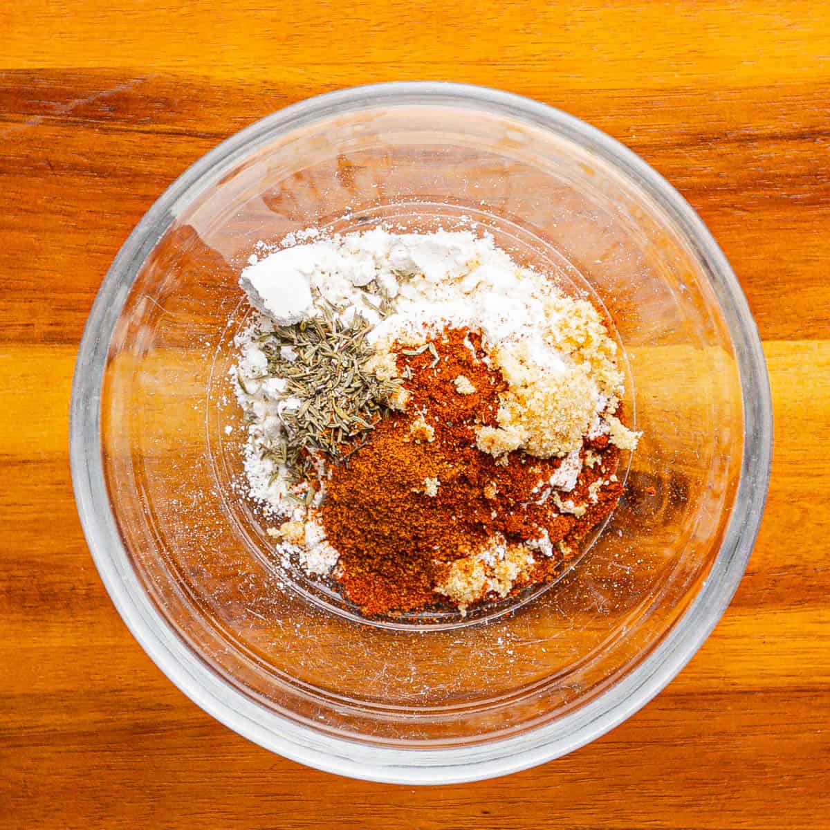 Combine flour, onion, garlic, thyme, cayenne pepper, paprika, kosher salt, and black pepper in a bowl. 