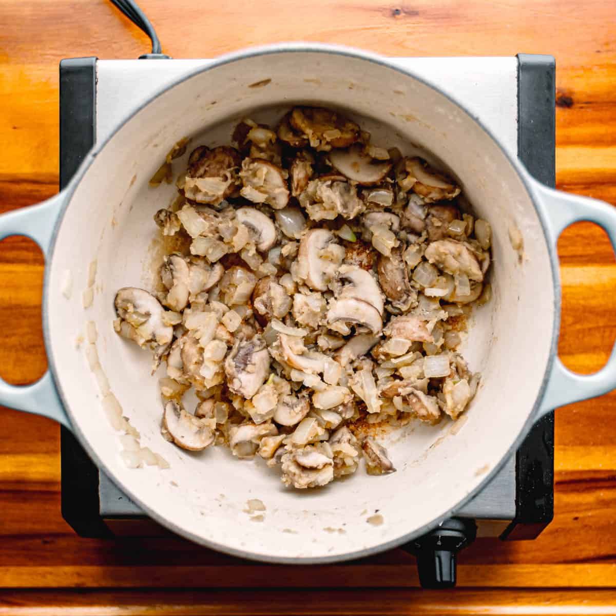 Sprinkle in the flour, stirring constantly for about 2 minutes until it emits a toasty aroma.