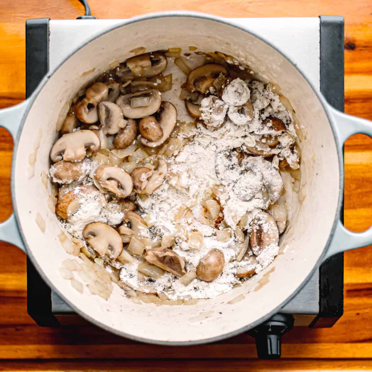 Sprinkle in the flour, stirring constantly for about 2 minutes until it emits a toasty aroma.