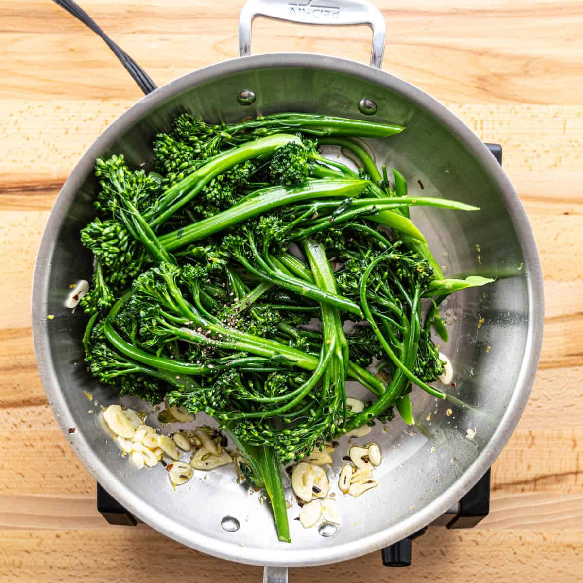 Throw the broccolini into the pan and give it a good stir for a couple of minutes until everything's mixed well.