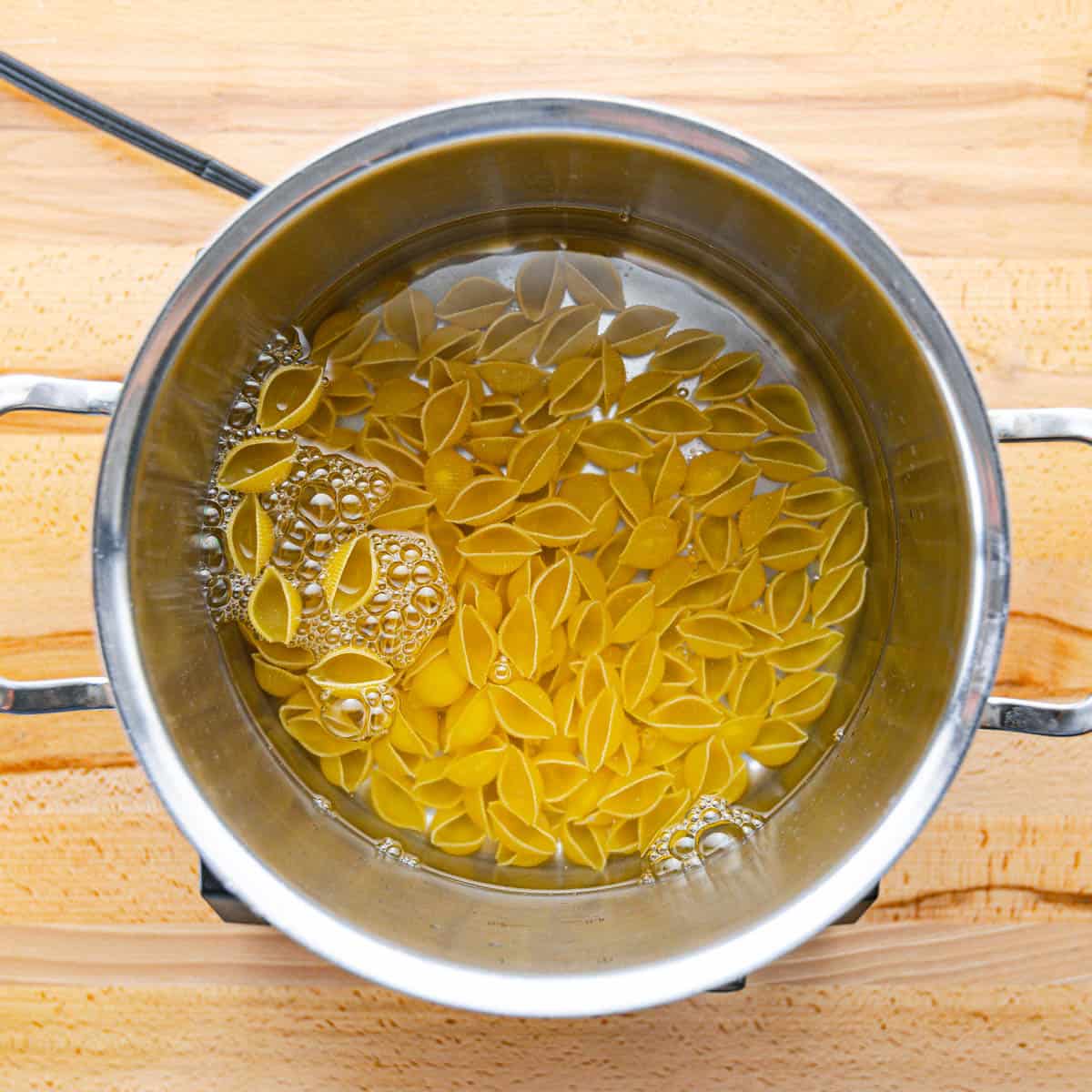 Bring salted water to a boil and cook pasta until al dente.