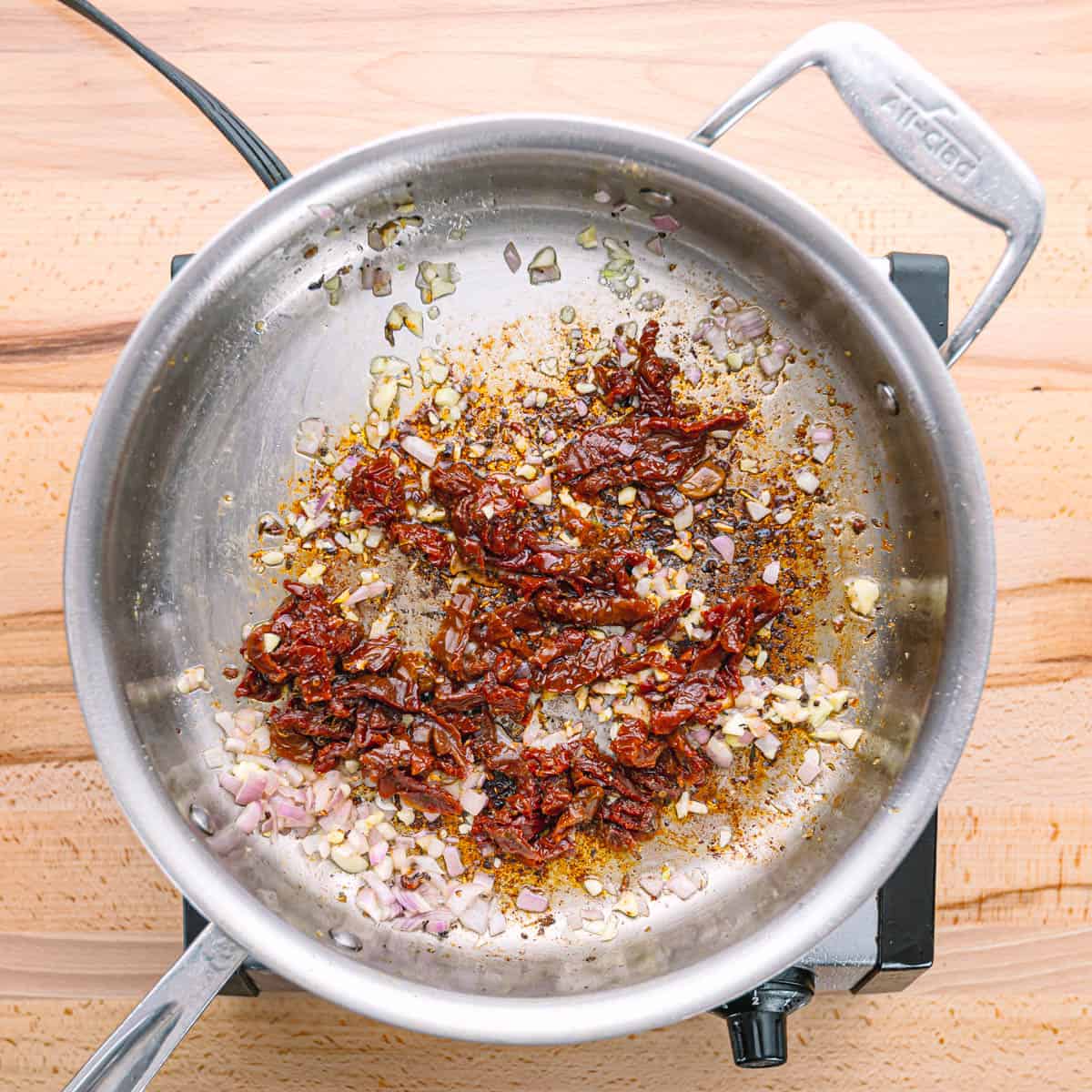 sauteeing shallots, garlic, and sun dried tomatoes. 