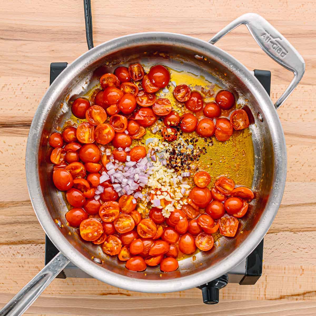 Stir in the minced garlic, salt, shallots, and red pepper flakes. Cook for another 1 minute, or until the garlic and shallots become fragrant.