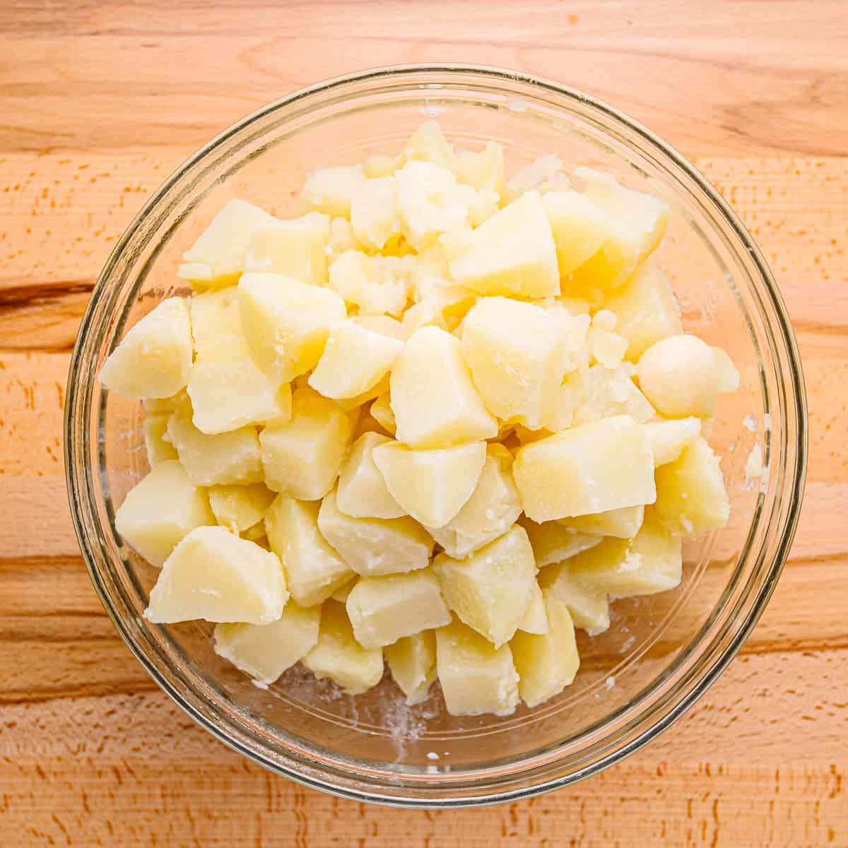 potatoes and garlic in a bowl. 