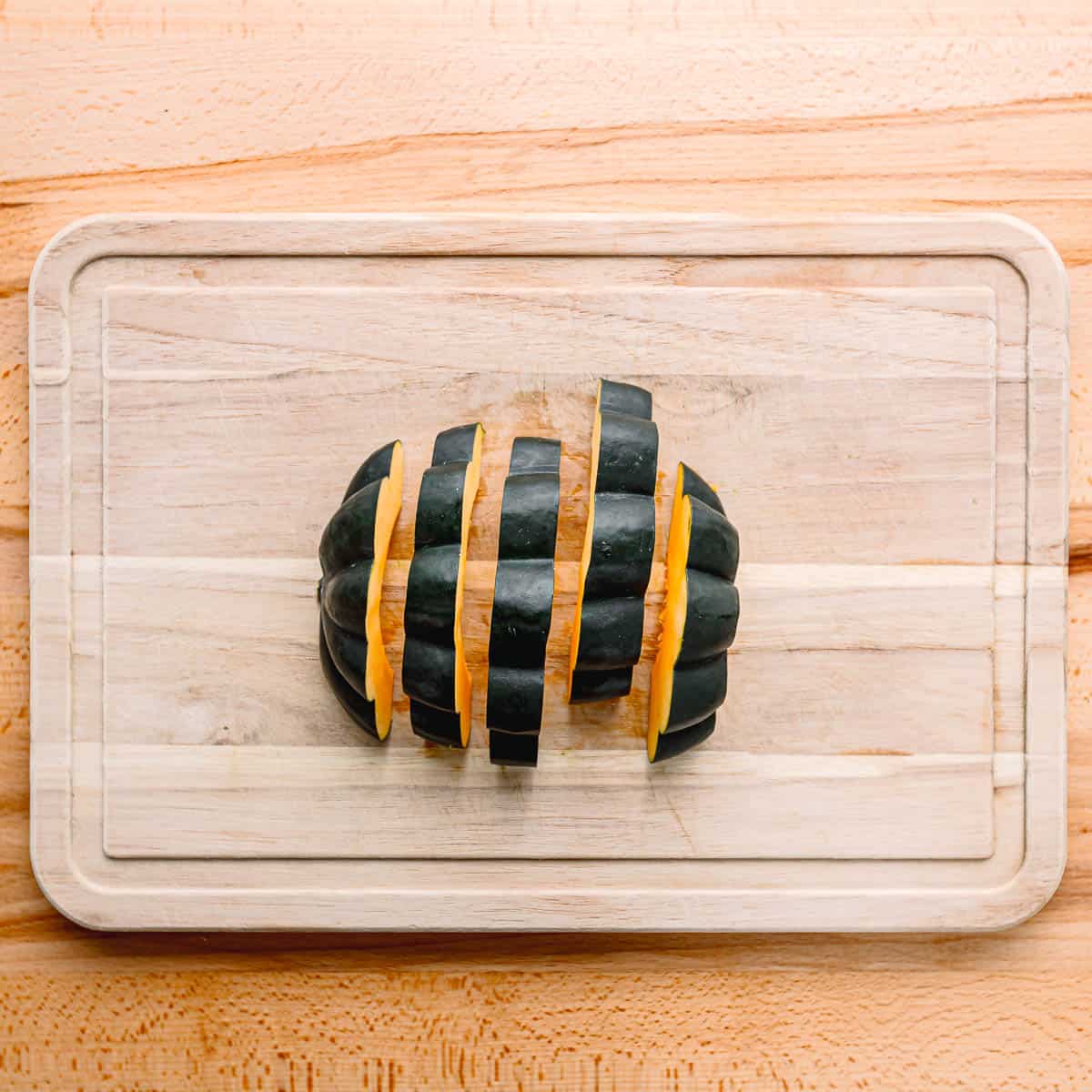 slicing acorn squash.