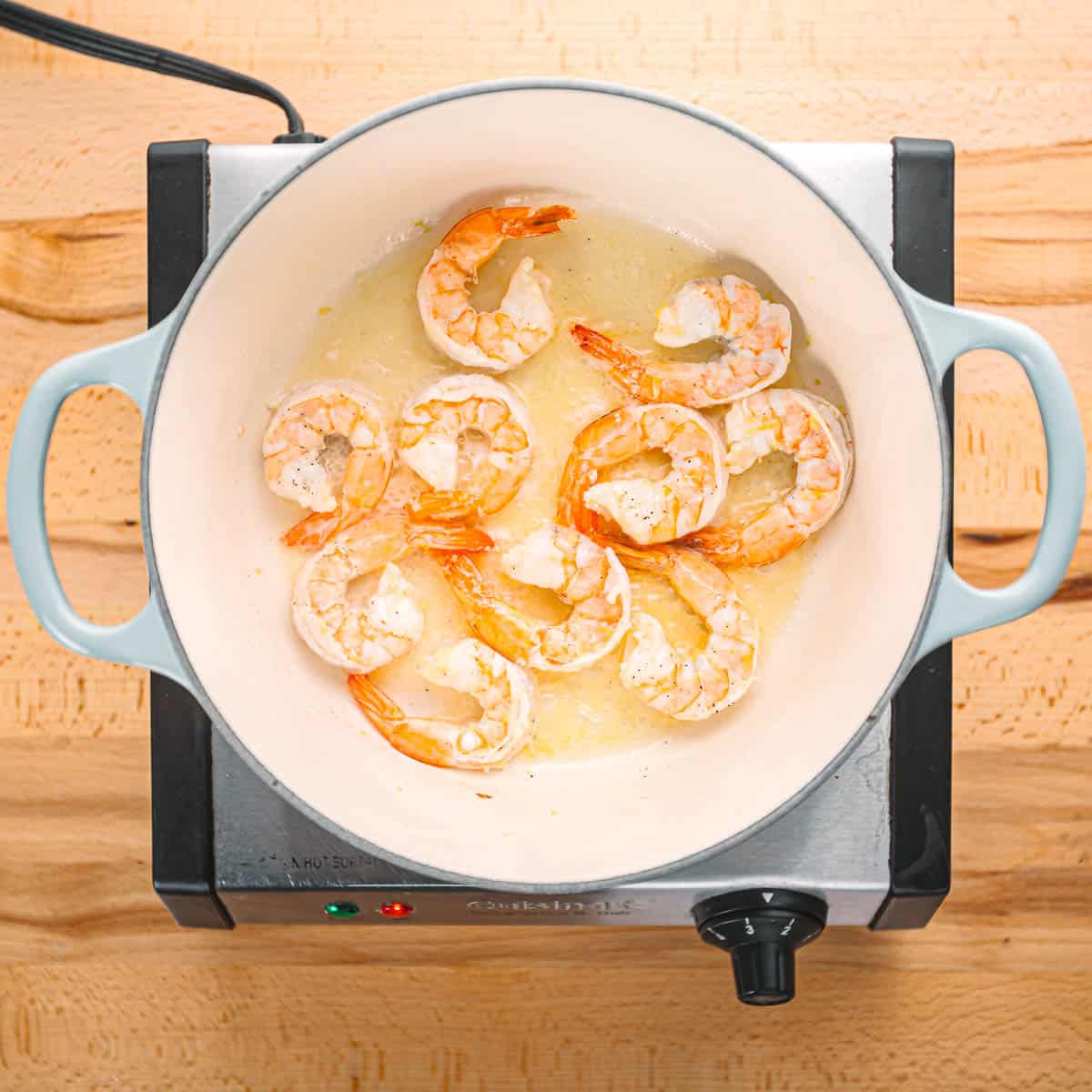 Sautéing shrimp. 