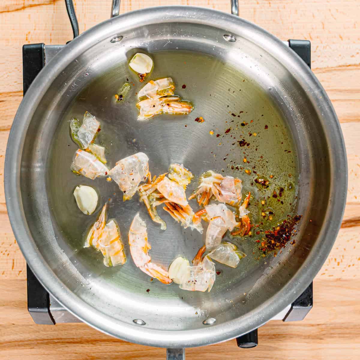 cook garlic and shrimp shells.