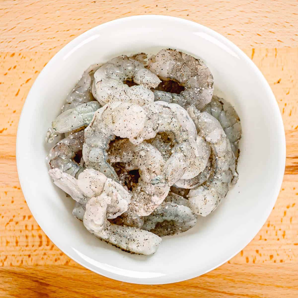 Season the shrimp with salt and set them aside