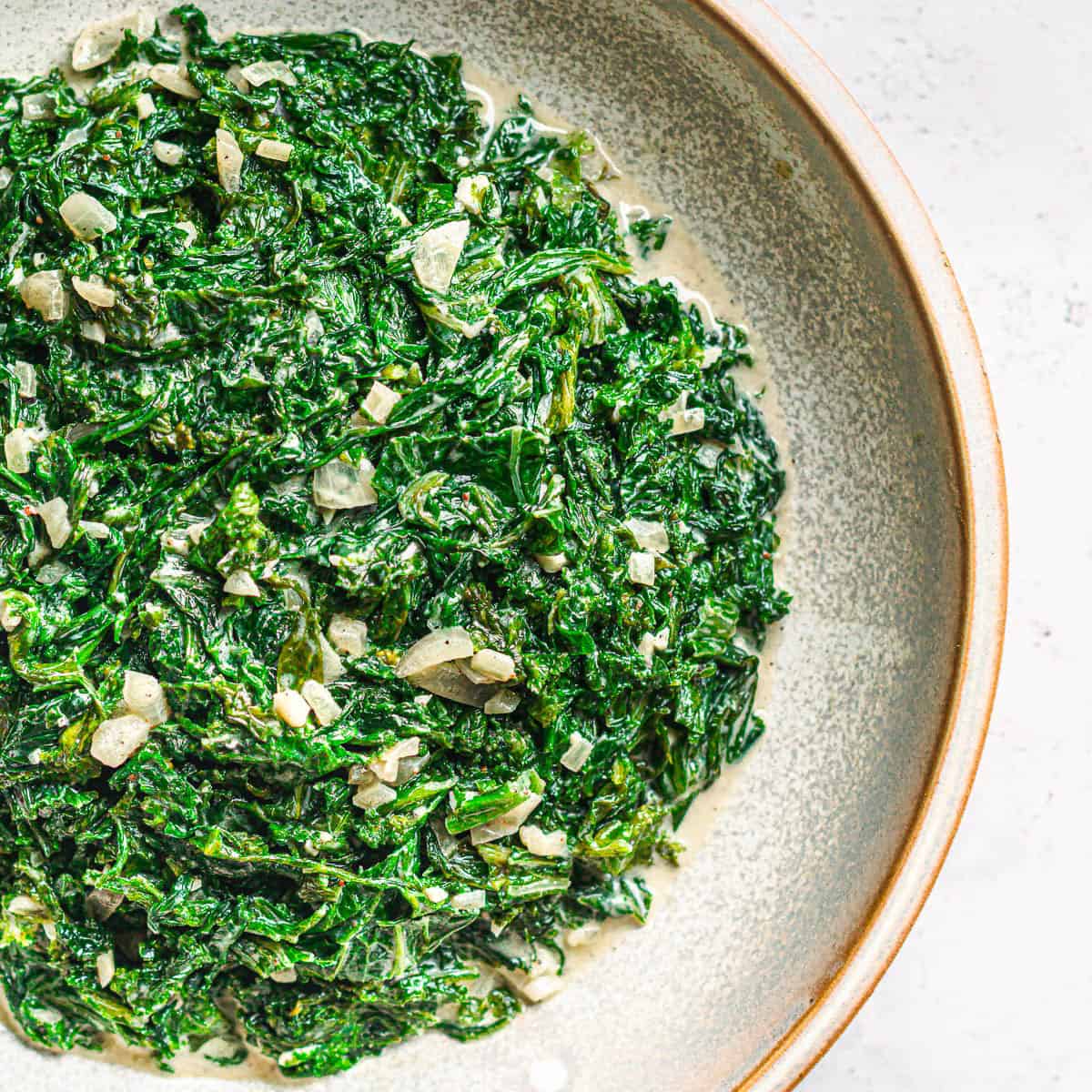 Homemade creamed mustard greens with shallots and cream sauce. 