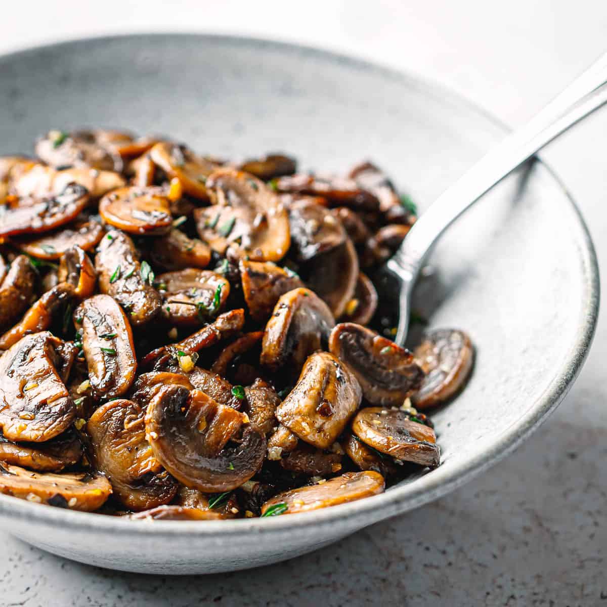 Close-up of golden brown sautéed mushrooms.