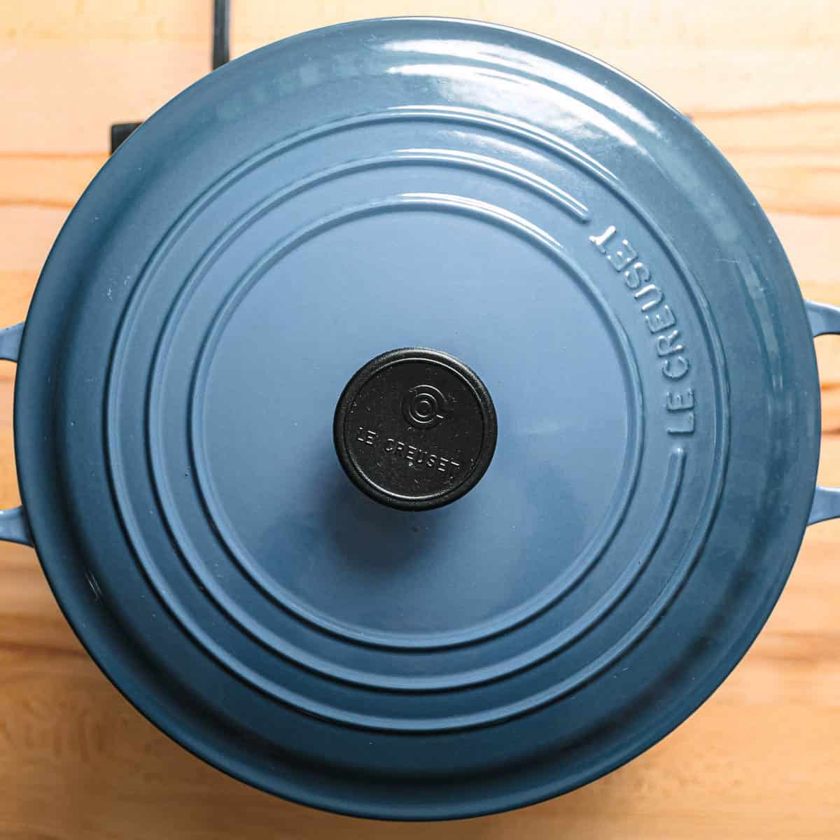 Simmering barley and lentils in broth.