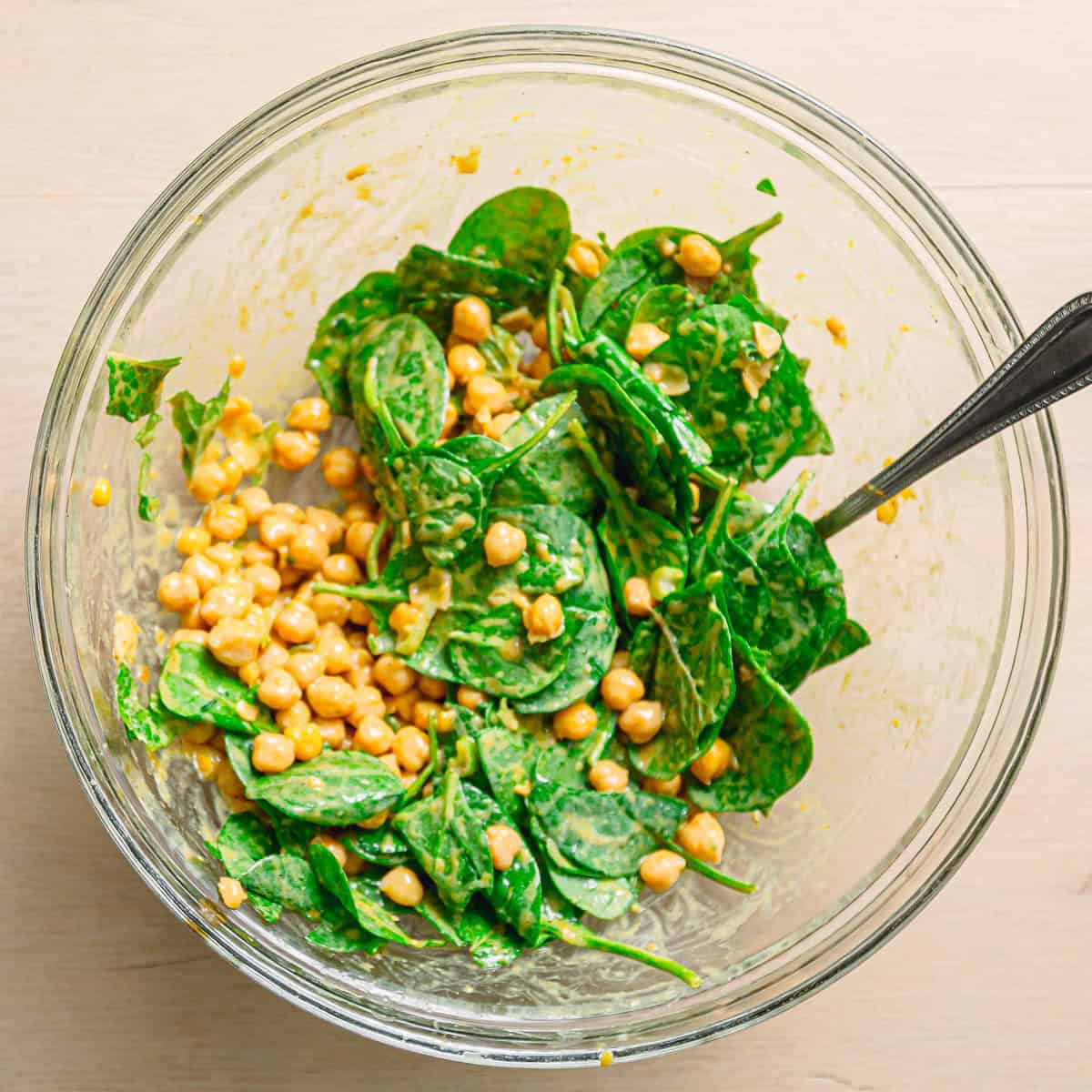 chickpea spinach salad tossed with curry vinaigrette.