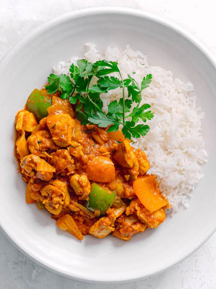 Homemade Chicken Jalfrezi served in white bowl.