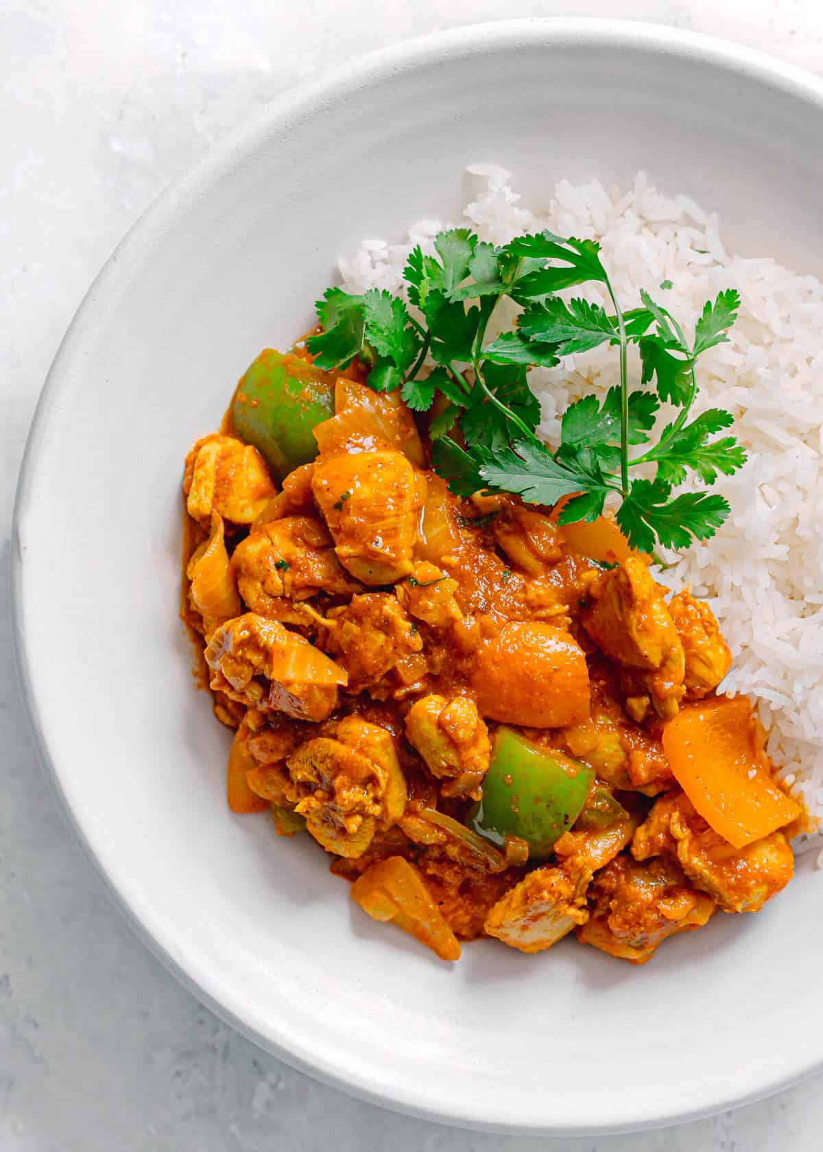 Chicken Jalfrezi served in white bowl.