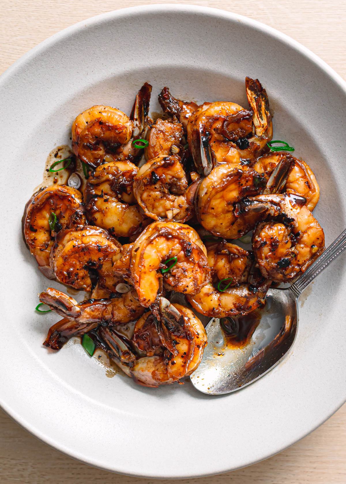 Glazed honey garlic shrimp in ceramic bowl quick seafood recipe.