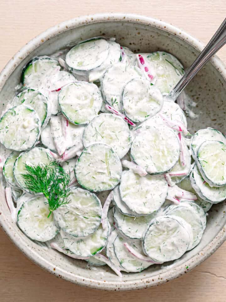 Easy cucumber dill salad recipe served in a ceramic bowl.